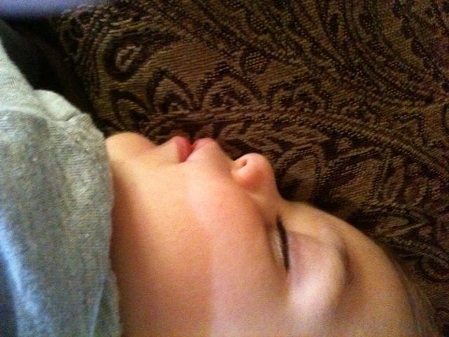 Peaceful little Lorenzo taking an afternoon nap on Daddy’s lap.