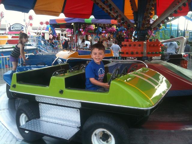 BooBoo riding the the Green Machine at the Spring Carnival