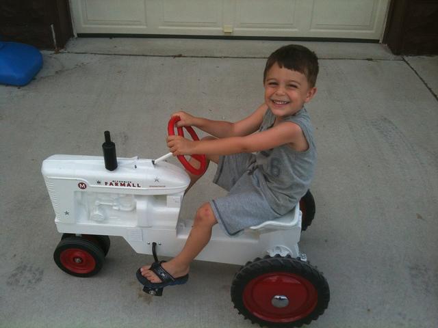 TheLittleGuyDrivingHisFarmallMDemonstrator_05072012
