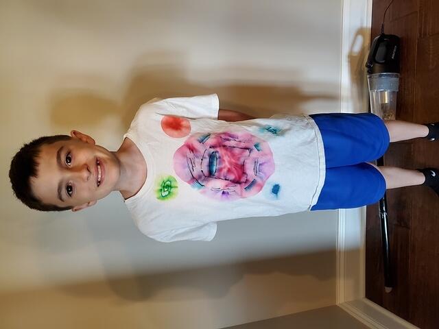 Luci's tie die Among Us shirt that he made in 3rd grade.
