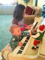 LorenzoAndGabriellaPlayingThePiano