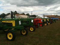A row of John Deers, a couble Farmalls and an Allis Chalmers at the Beaver Valley Antique Equipment Show 09-11-2010.