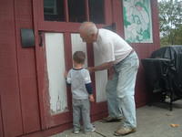 Boo Boo Helping Papa Sand the Shed Door 10-17-2011