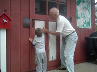 Boo Boo Helping Papa Sand the Shed Door 10-17-2011