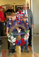 LorenzoHelpingPresentWreathForWeirtVeteransCeremony 11112017