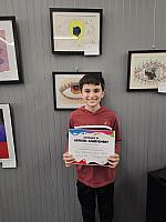 Luciano with his Artwork that was selected to be on display at the Summit Art Gallery in Weirton