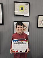 Luciano with his Artwork that was selected to be on display at the Summit Art Gallery in Weirton