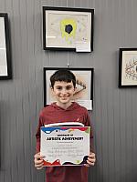 Luciano with his Artwork that was selected to be on display at the Summit Art Gallery in Weirton